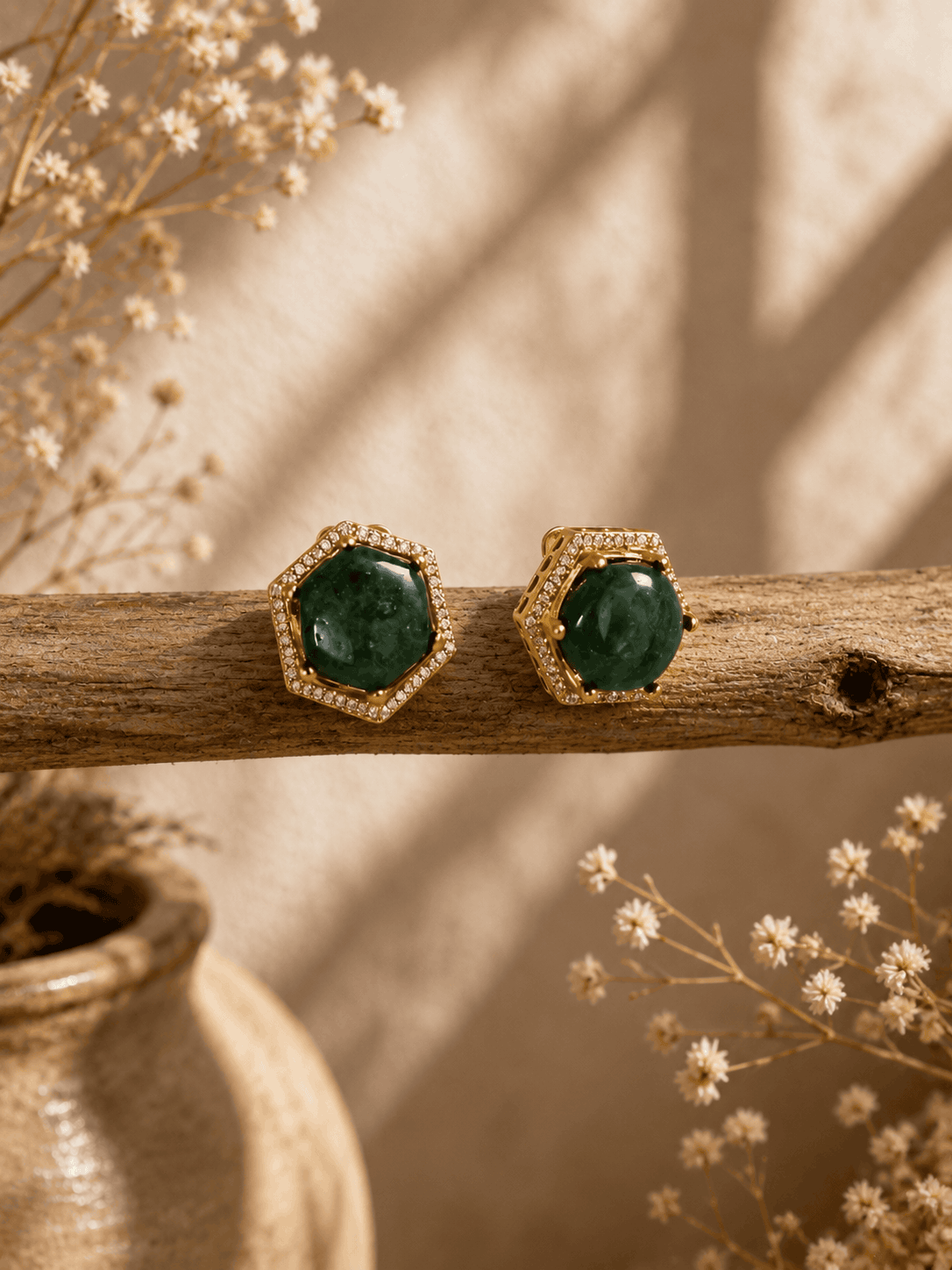Dark-green gemstone stud earrings with ornate gold-tone octagonal setting