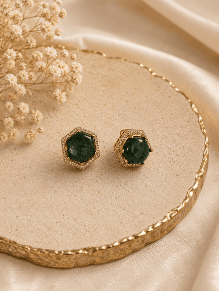Gold-tone hexagon halo stud earrings with round dark-green gemstone