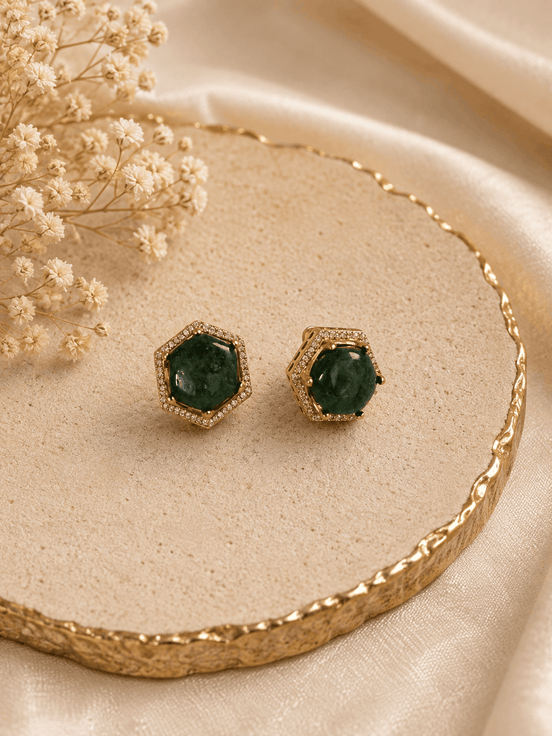 Gold-tone hexagon halo stud earrings with round dark-green gemstone