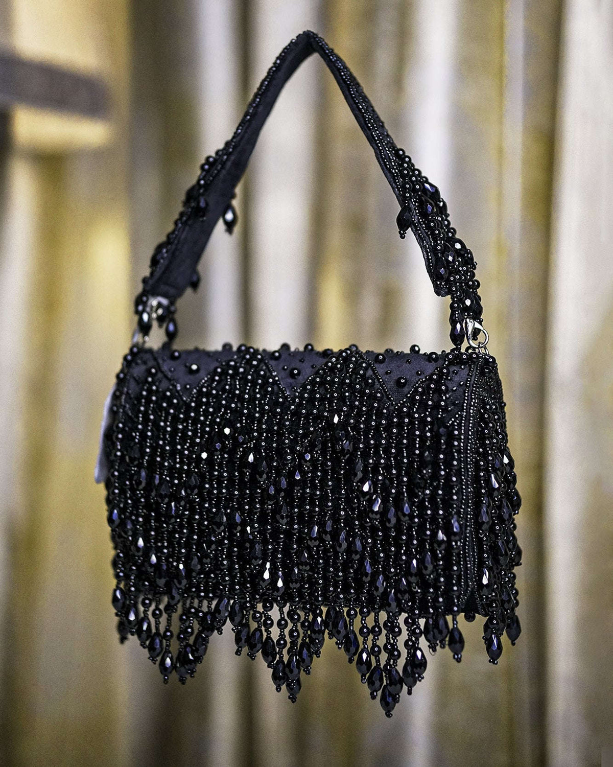 Black velvet hobo bag with crystal bead fringe and braided top handles