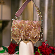 Pink velvet hobo bag with crystal bead fringe and braided top handles