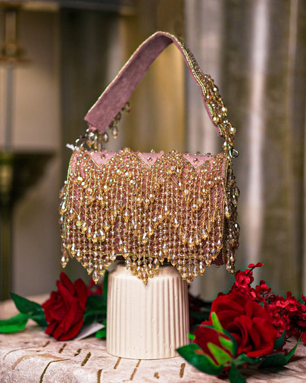 Pink velvet hobo bag with crystal bead fringe and braided top handles