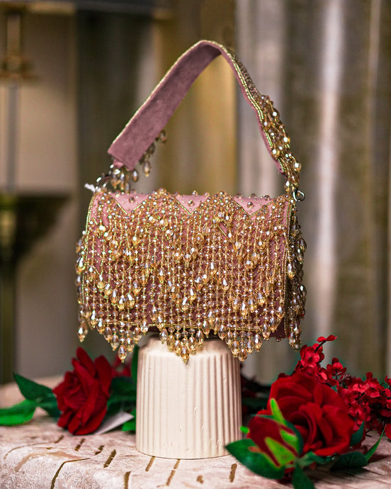 Pink velvet hobo bag with crystal bead fringe and braided top handles