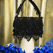 Black crystal hobo bag with top handles and beaded fringe bottom