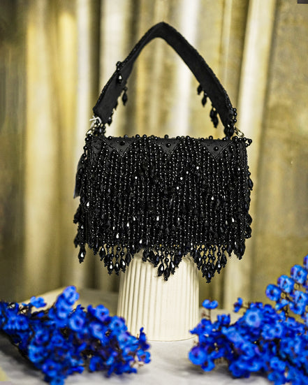 Black crystal hobo bag with top handles and beaded fringe bottom
