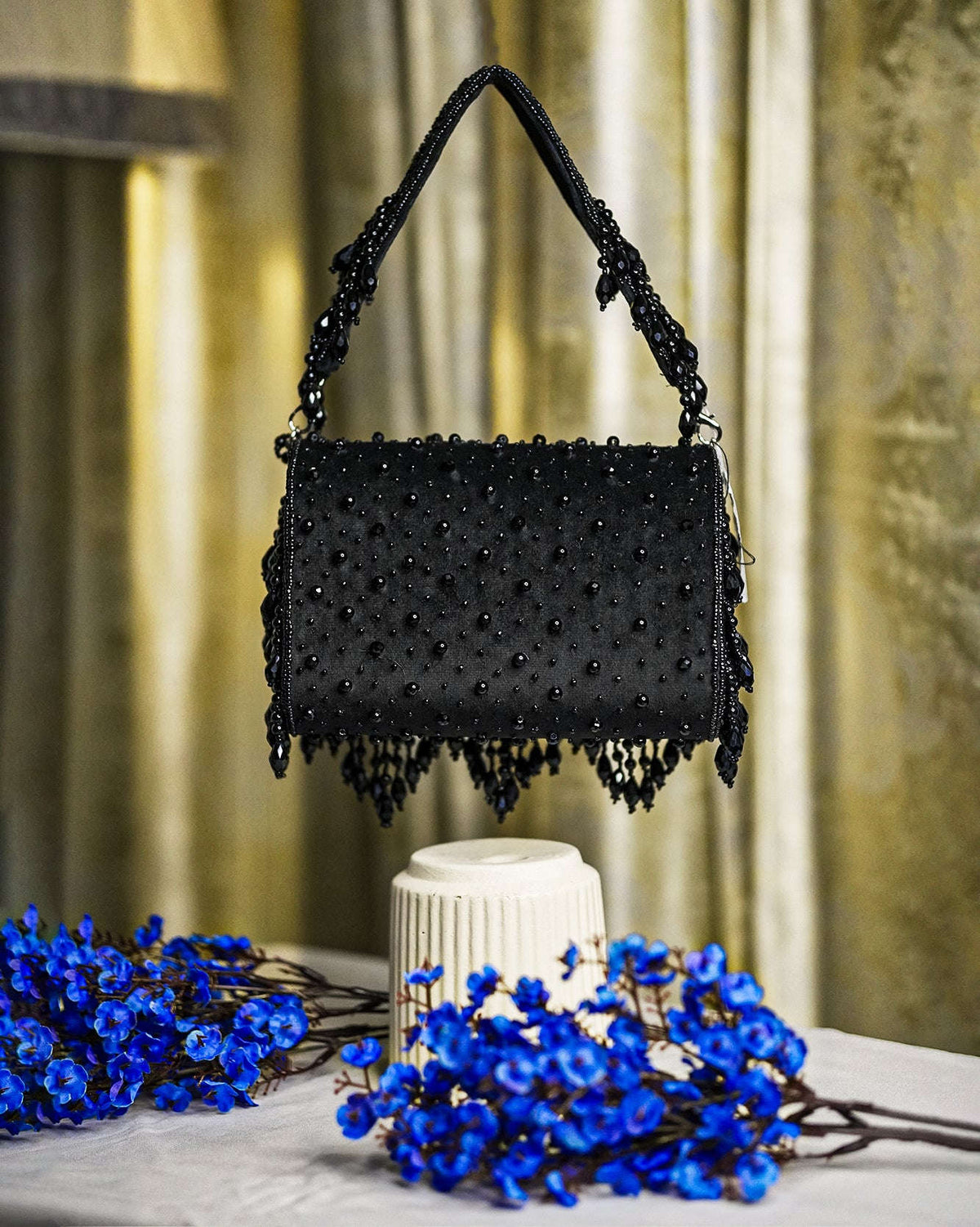 Black crystal beaded hobo bag with top handles and fringe trim