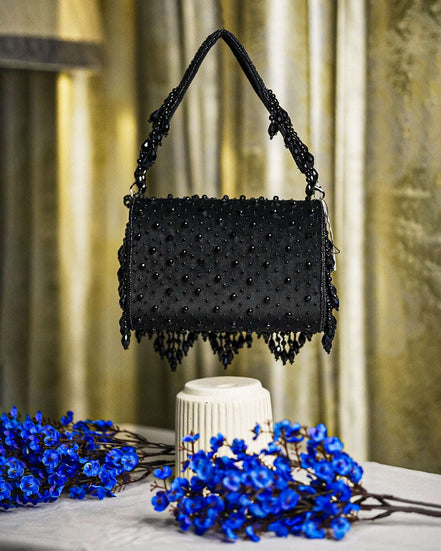 Black crystal beaded hobo bag with top handles and fringe trim