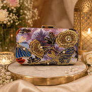 Multicolor floral clutch with ornate gold embellishments and gold-tone clasp