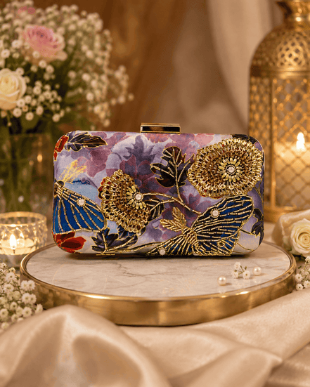 Multicolor floral clutch with ornate gold embellishments and gold-tone clasp