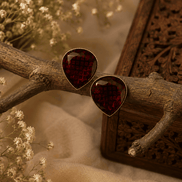 Wine red teardrop stud earrings with textured faceted stones