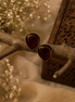 Wine red teardrop stud earrings with textured faceted stones