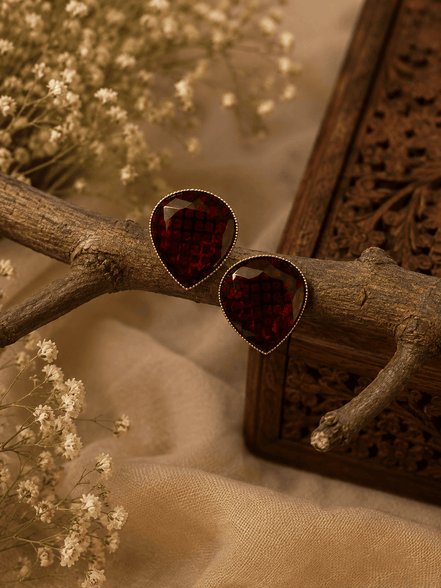 Wine red teardrop stud earrings with textured faceted stones