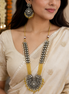 Gold-tone long necklace set with yellow center pendant and matching round earrings