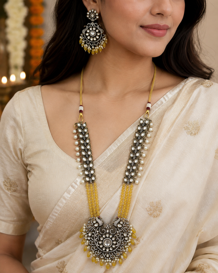 Gold-tone long necklace set with yellow center pendant and matching round earrings