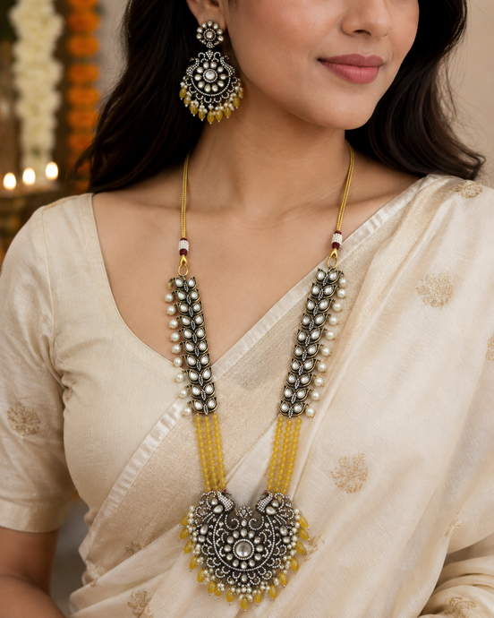 Gold-tone long necklace set with yellow center pendant and matching round earrings