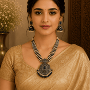 Navy blue beaded pearl necklace set with ornate pendant and dangling earrings