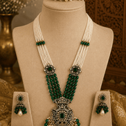 Emerald green beaded pearl necklace set with ornate pendant and matching stud earrings