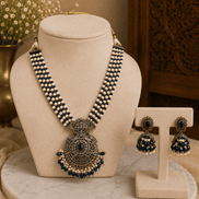 Navy blue beaded pearl necklace set with large round pendant and stud earrings