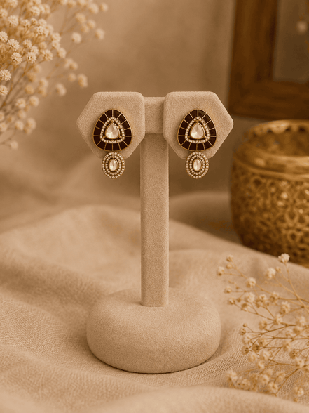 Gold stud earrings with black teardrop center and matching drop detail