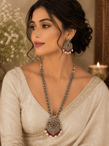 Wine statement necklace and earrings on model: silver-tone maroon pendant with dangling pearl drops