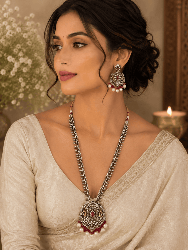 Wine statement necklace and earrings on model: silver-tone maroon pendant with dangling pearl drops