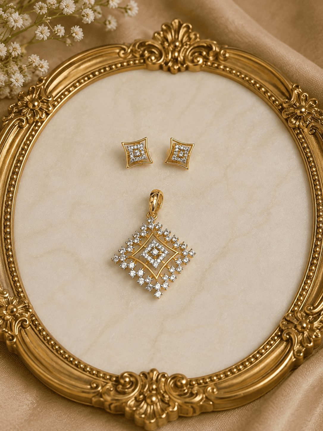 Gold-tone square crystal pendant and matching stud earrings on ornate jewelry display