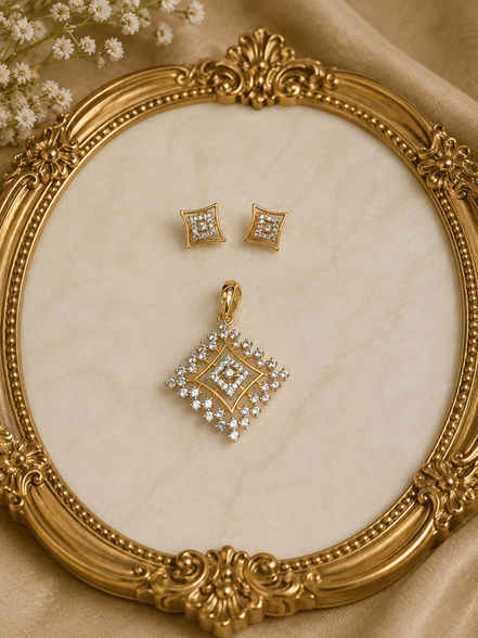 Gold-tone square crystal pendant and matching stud earrings on ornate jewelry display