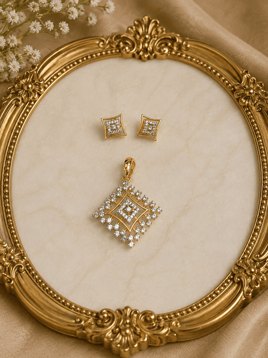 Gold-tone square crystal pendant and matching stud earrings on ornate jewelry display