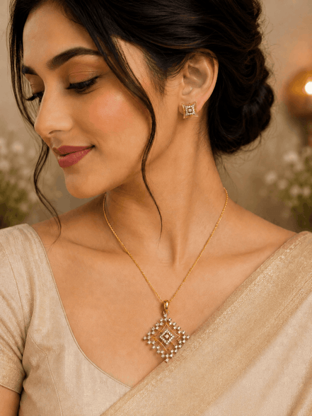 Gold-tone pendant necklace with square crystal pendant and matching stud earrings
