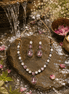 Necklace set with pink teardrop pendant and matching earrings