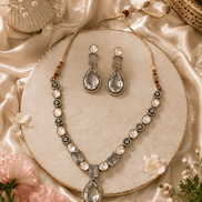 Clear teardrop crystal necklace set with oval connectors and stud drop earrings