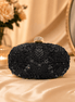 Black beaded clutch with gold-tone top frame and ornate beadwork
