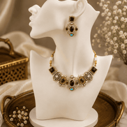 Gold-tone choker necklace set with purple and teal stones; matching drop earrings