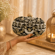 Black and gold beaded clutch with rounded top clasp