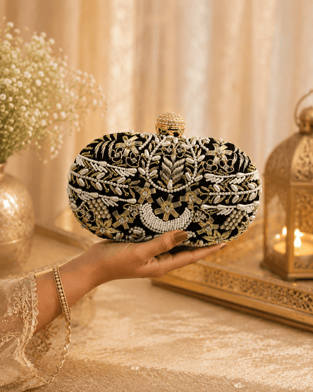 Black and gold beaded clutch with rounded top clasp