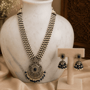 Navy blue pearl necklace set with round pendant and matching stud earrings