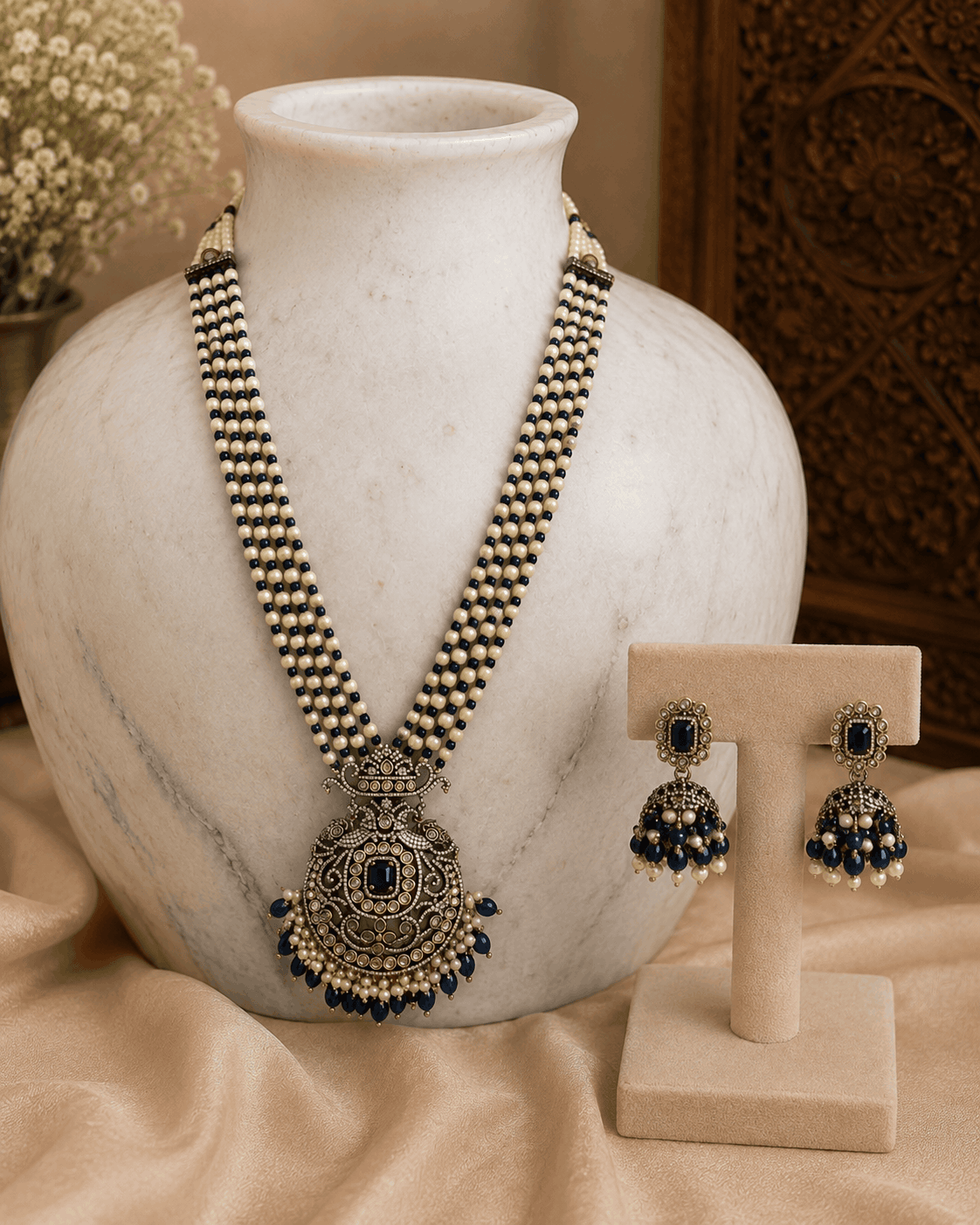 Navy blue pearl necklace set with round pendant and matching stud earrings
