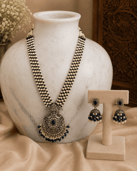 Navy blue pearl necklace set with round pendant and matching stud earrings