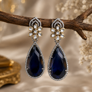Statement floral teardrop earrings with faceted peacock blue stones and rhinestone trim