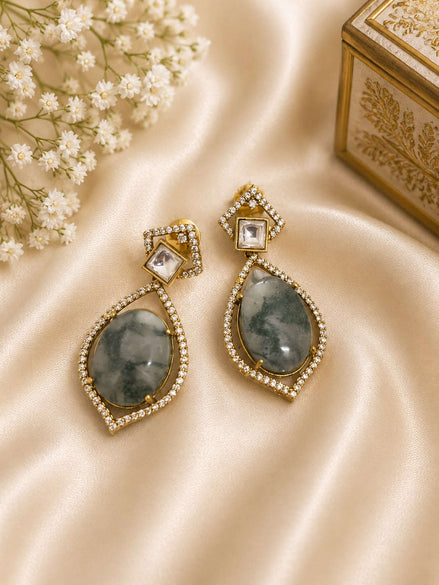 Gold-tone drop earrings with square stud and teardrop dark green stones