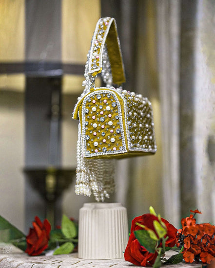 Mustard-trim pearl crystal fringe handbag with short chain handle and dangling beads