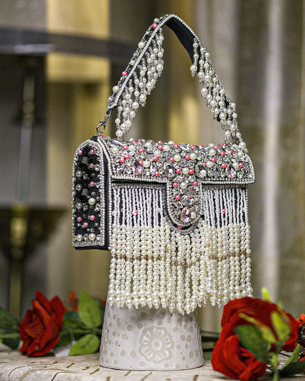 Black pearl crystal fringe handbag with jeweled flap, tassel fringe, and arched handle