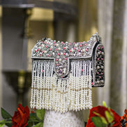Black pearl crystal fringe handbag with jeweled flap, tassel fringe, and side beading