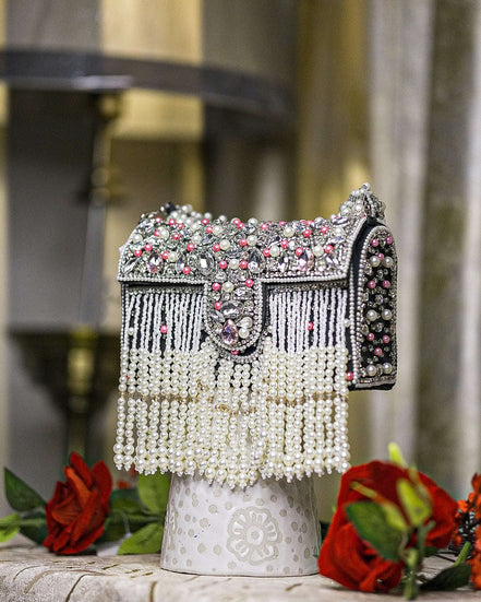 Black pearl crystal fringe handbag with jeweled flap, tassel fringe, and side beading