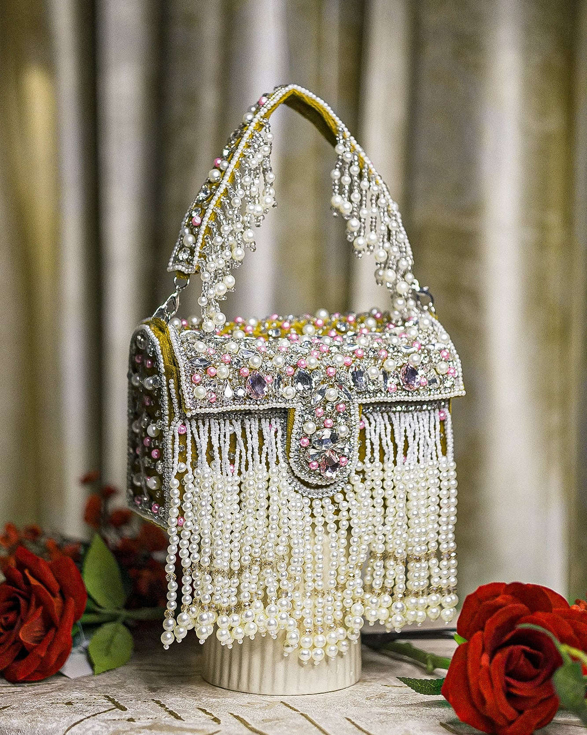 Pearl crystal fringe handbag with mustard trim, jeweled flap, and hanging bead strands