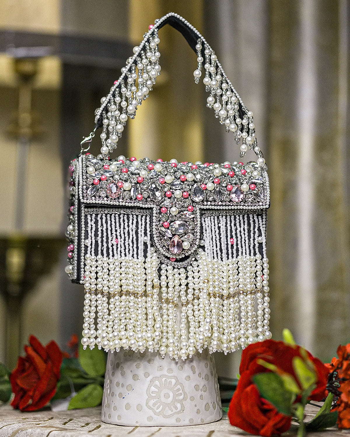 Black pearl crystal fringe handbag with arched handle, jeweled clasp, and dangling beads