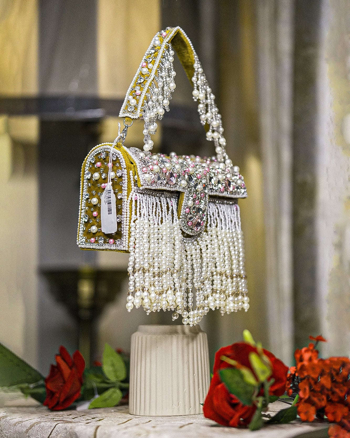 Mustard-trim pearl crystal fringe handbag with side tassel detail and arched handle