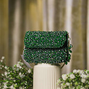Emerald green crystal mini bag with flap closure and side beaded tassel details