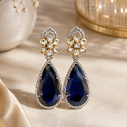 Floral teardrop statement earrings with blue gemstone drops and crystal flower tops