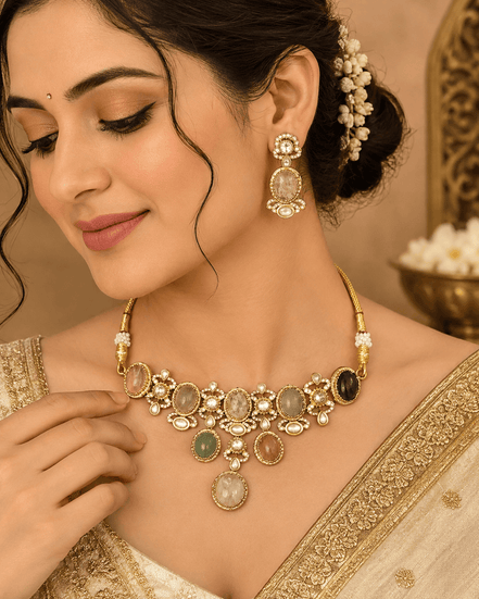 Gold-tone necklace with multicolor stones and round dangling earrings on model